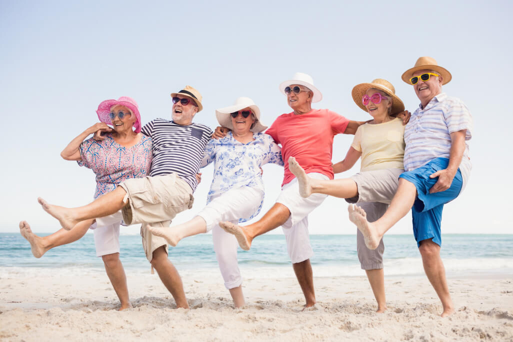 Seniors dancing on the beach